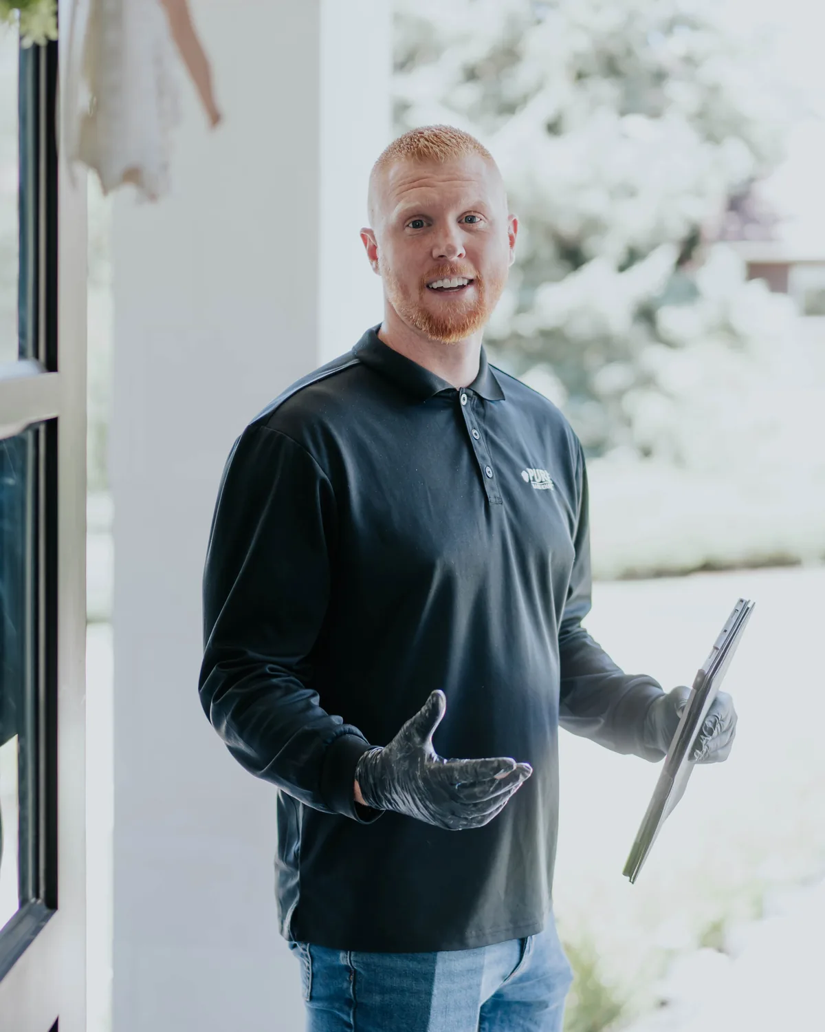 A Pure Maintenance technician arriving at a customer&rsquo;s front door